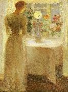 Anna Ancher ung pige foran en tandt lampe painting